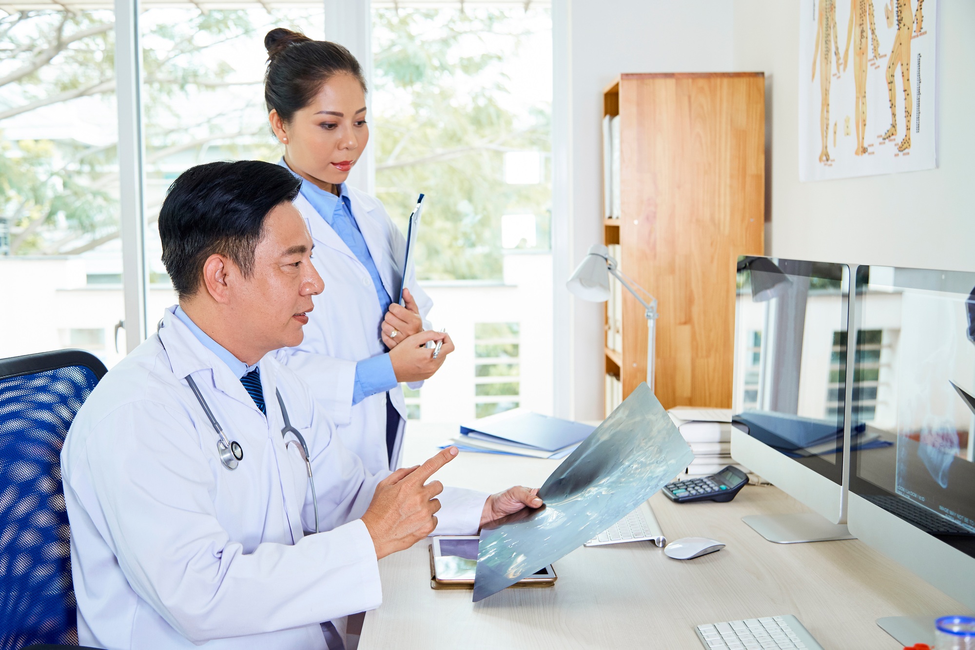 Two Asian Doctors Coworking